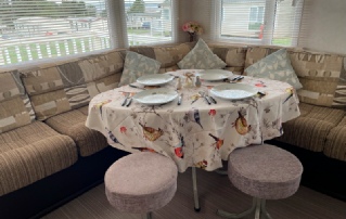 Indoor dining at accessible caravan Susan based in Kent.
